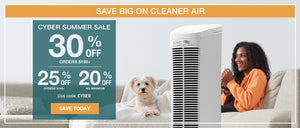Cyber Summer Sale.  Image features a woman sitting on a couch next to a small white dog, with the IONIC Comfort air purifier.